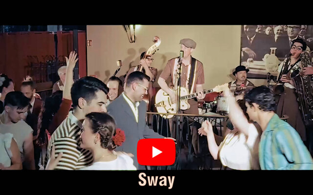 Man sieht Tänzer ausgelassen tanzen. Darunter steht der Songtitel "Do You Wanna Be My Baby" mit dem YouTube Logo darüber.